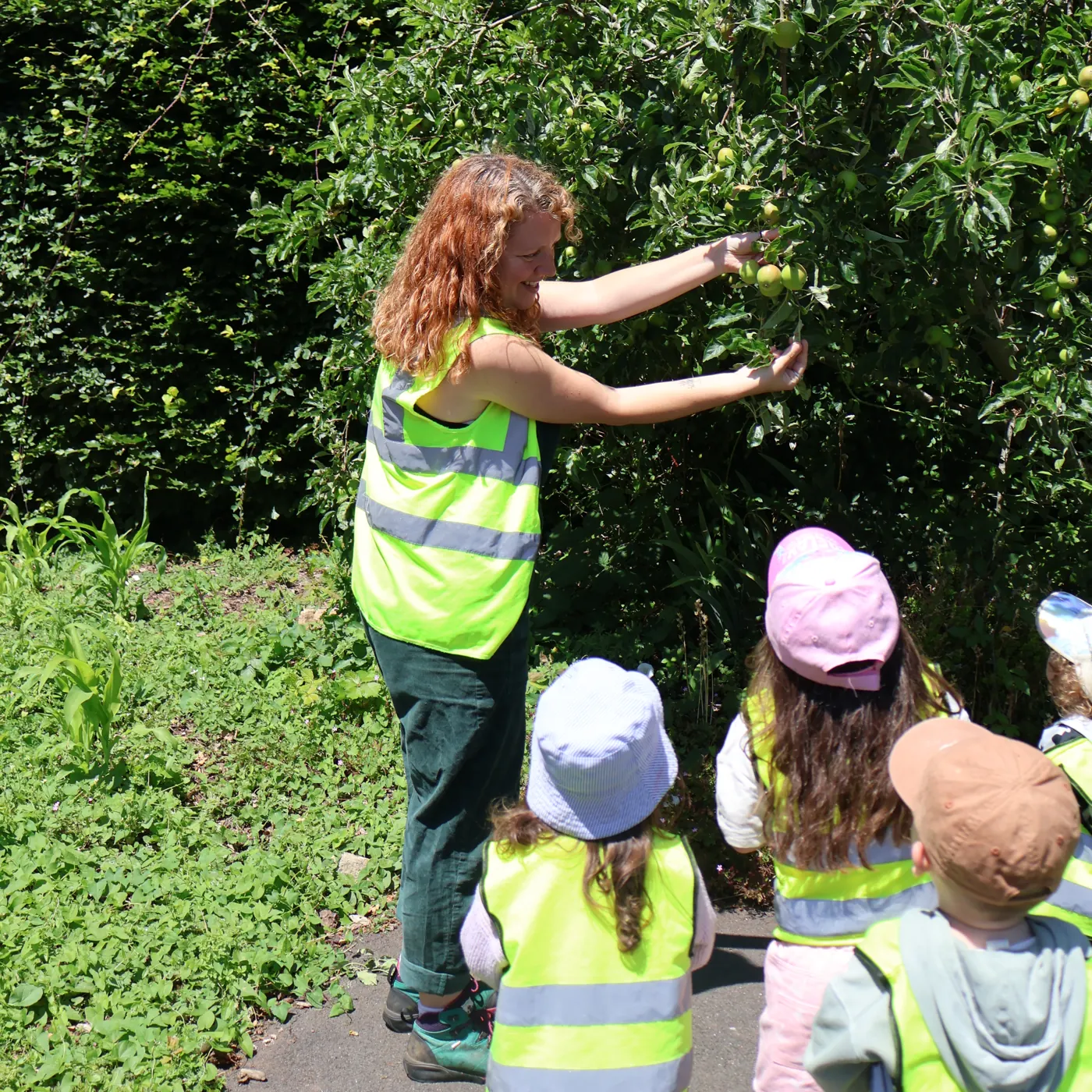 Children exploring the woodland at forest school in Midsomer Norton